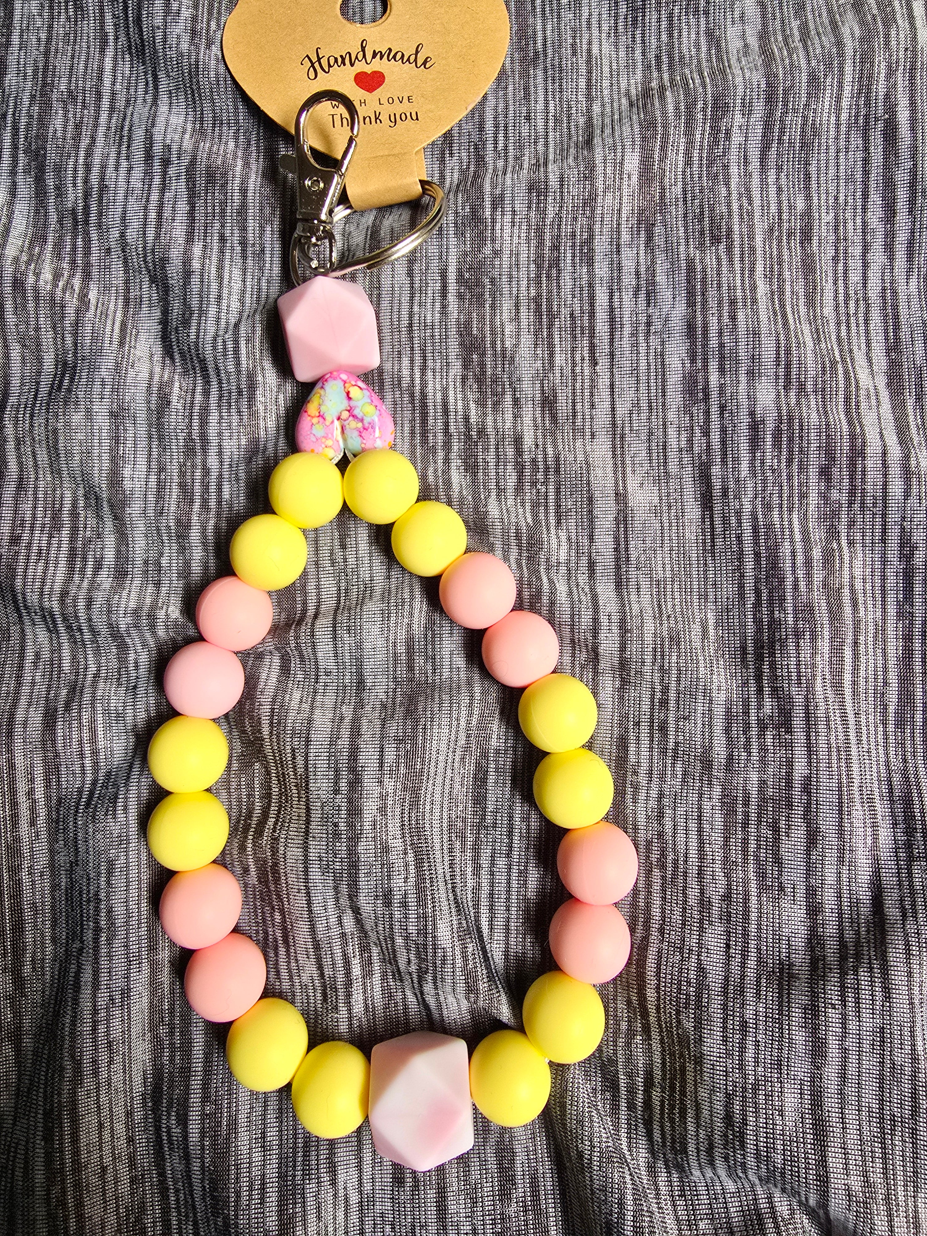 Pink and yellow beaded wristlet