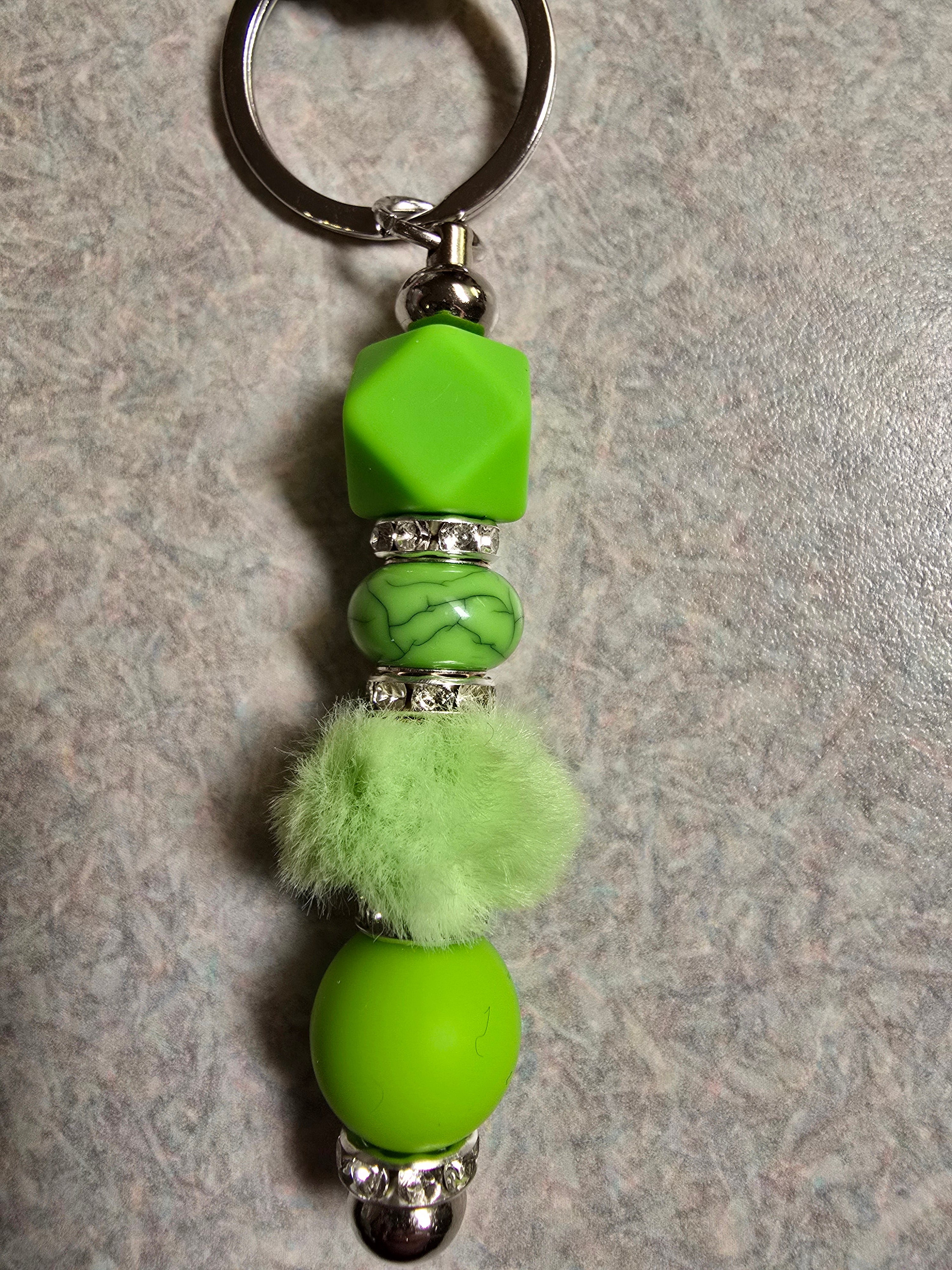 Green beaded and fuzzy keycahin