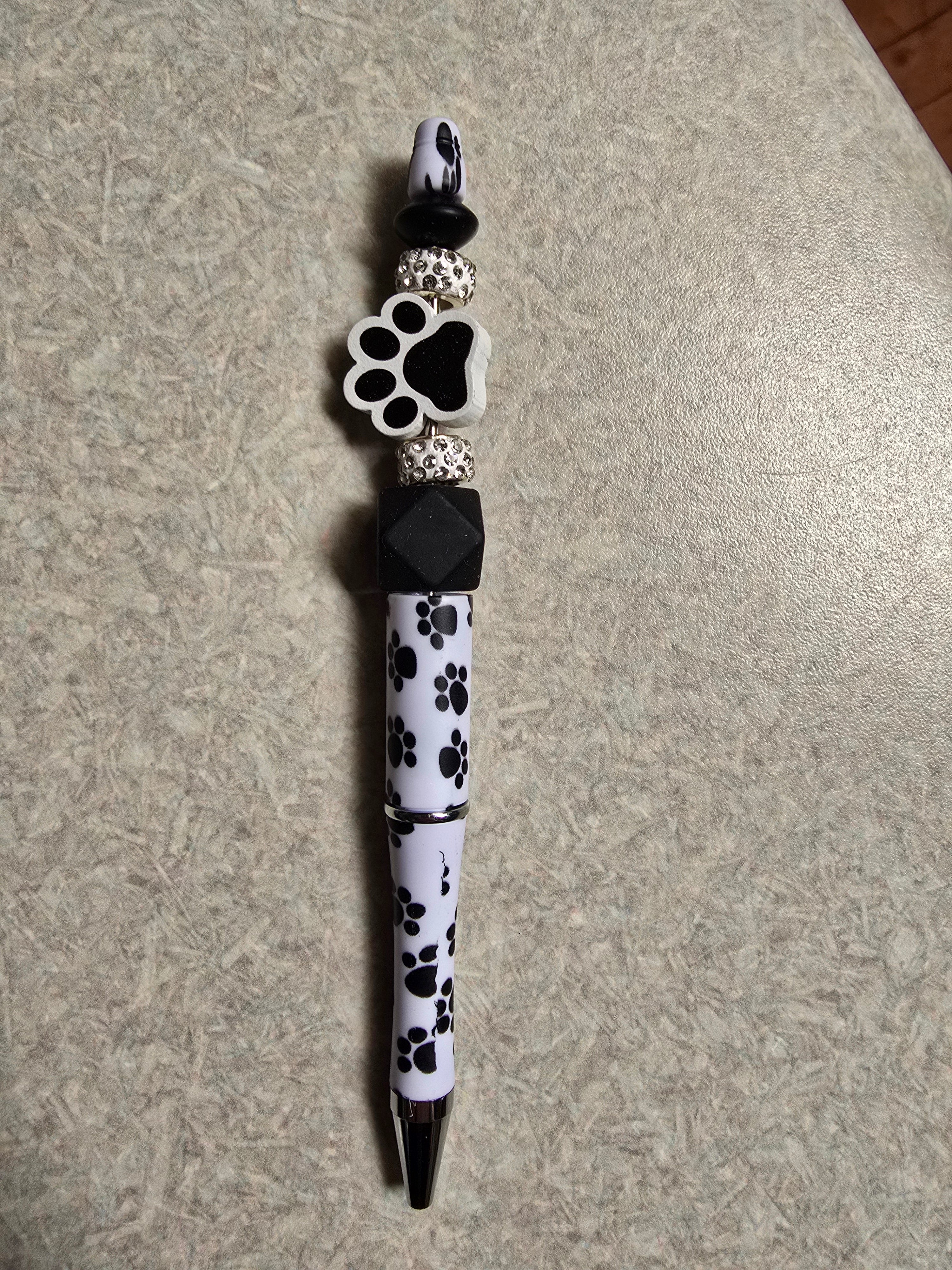 Black paw print pen