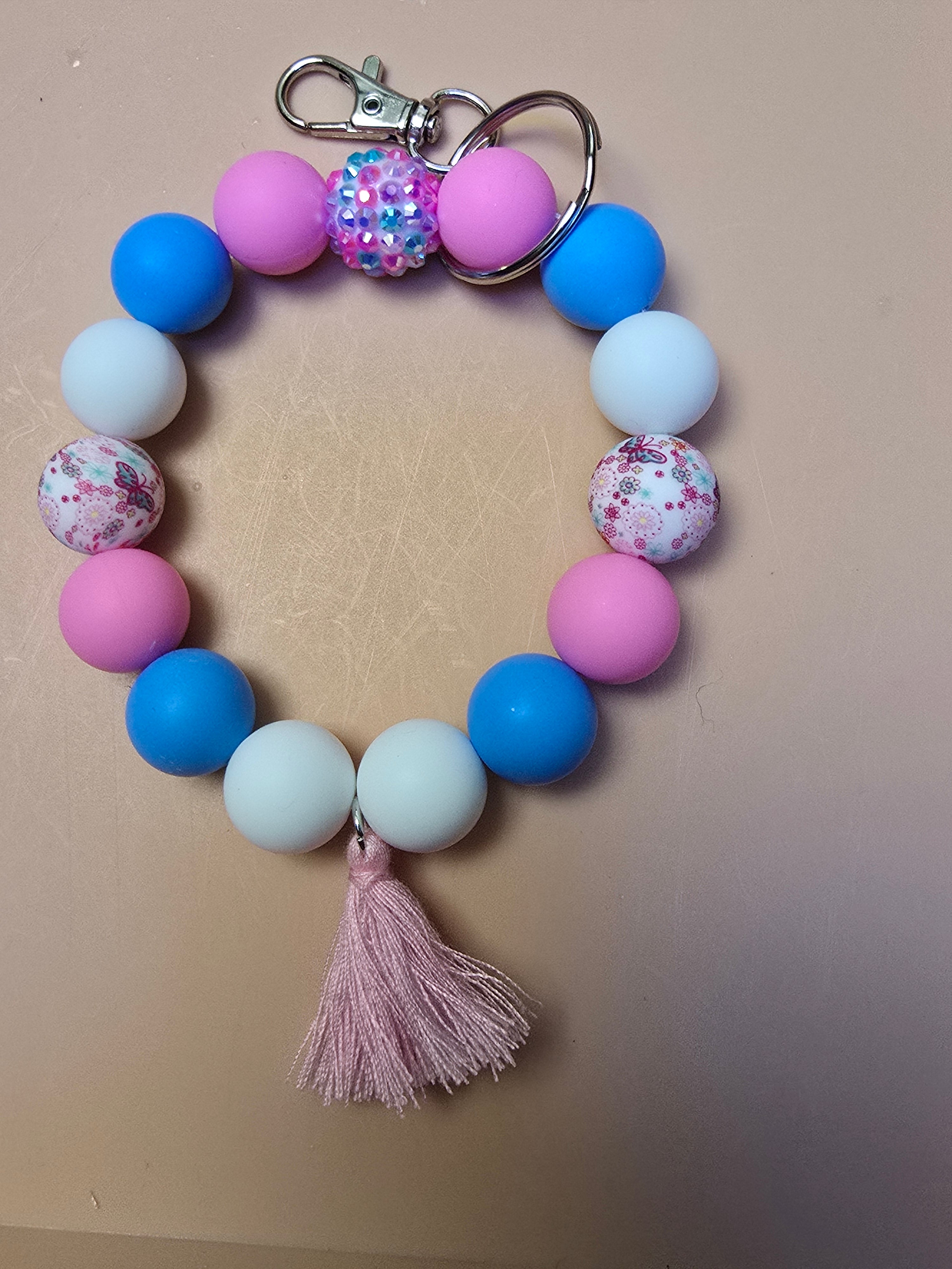 Pink, blue, and white wristlet keychain