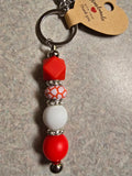 Red and white Canada Day inspired keychain.