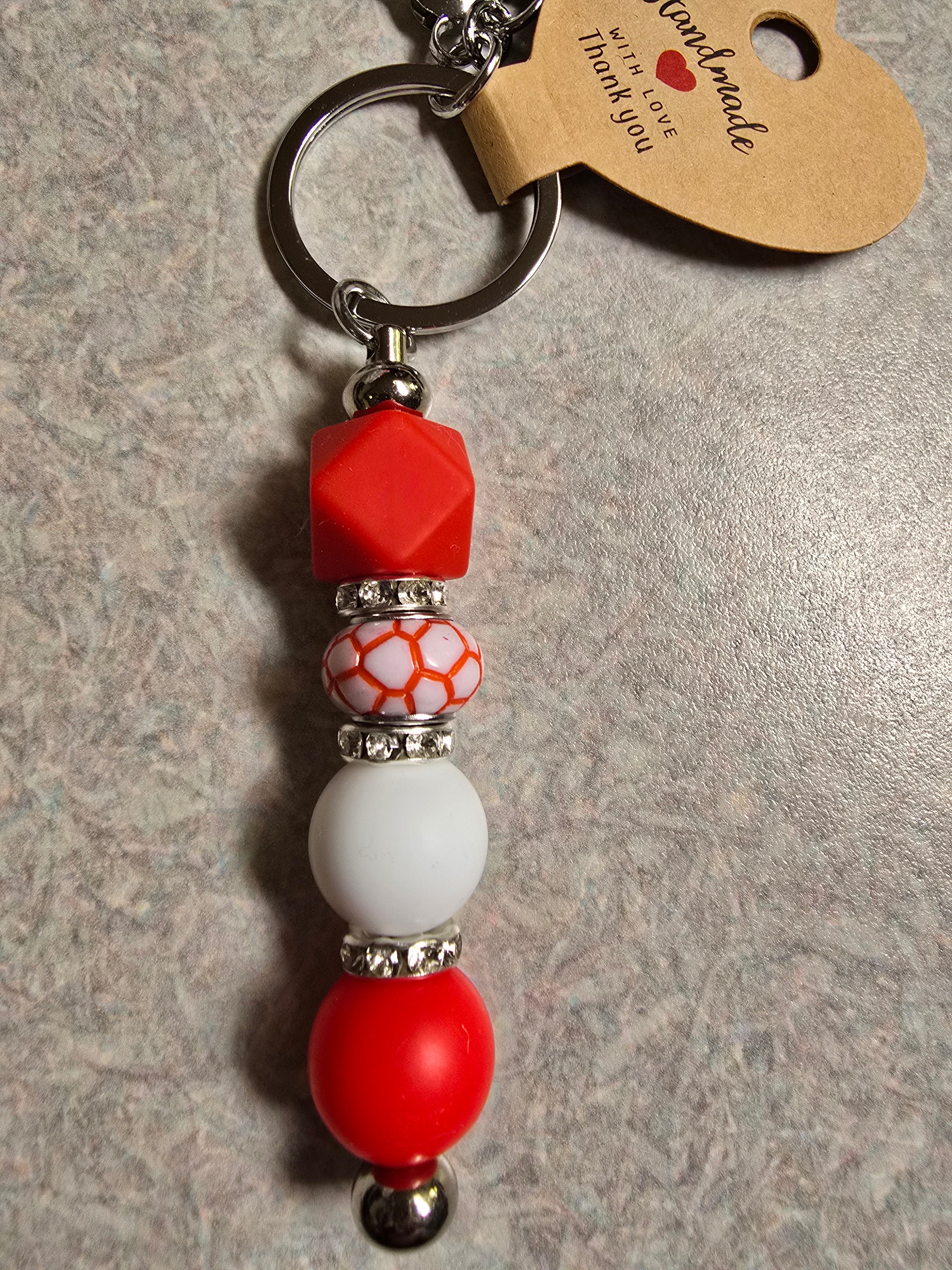 Red and white Canada Day inspired keychain.
