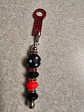 Red and black straw charm