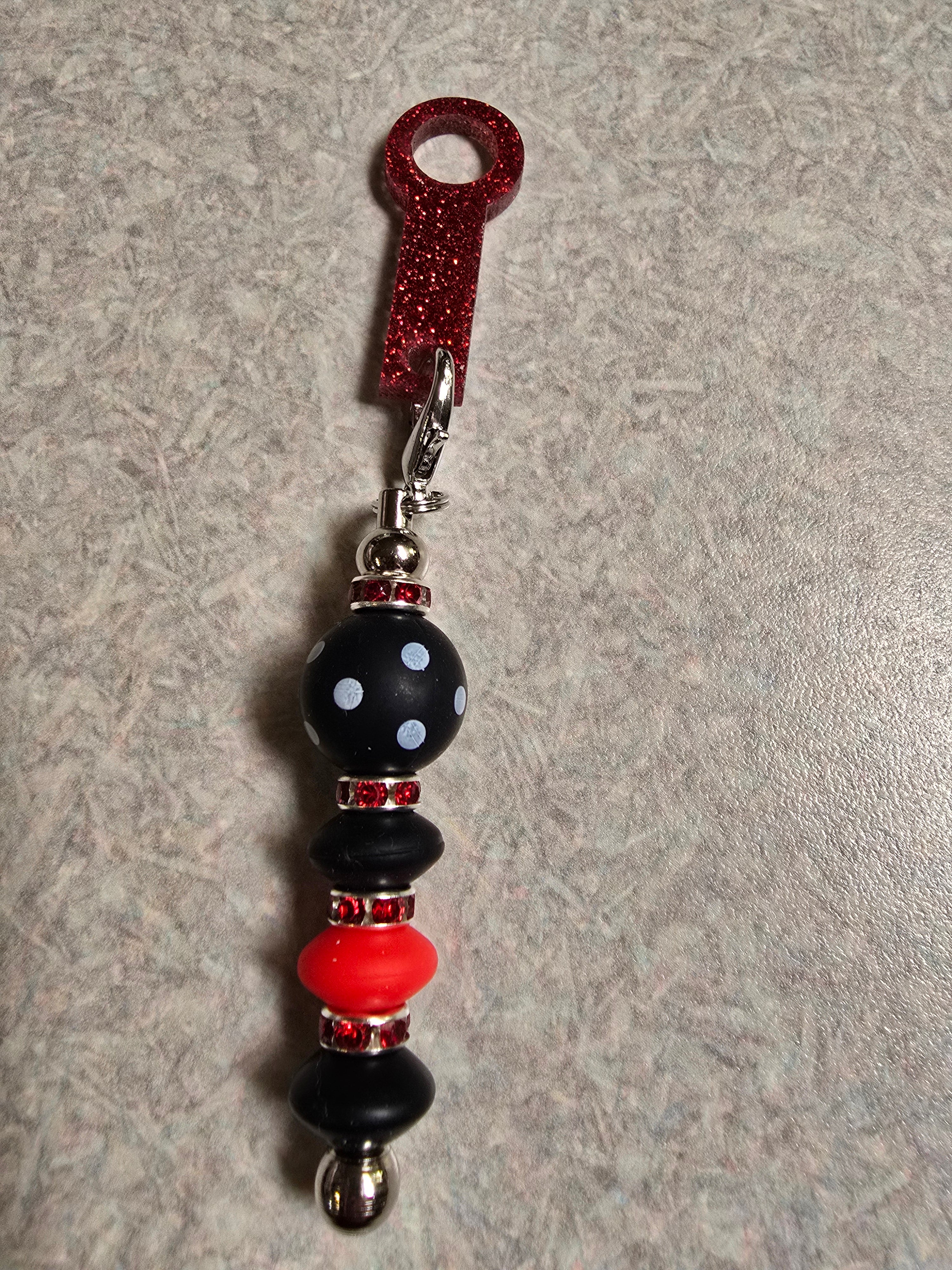 Red and black straw charm