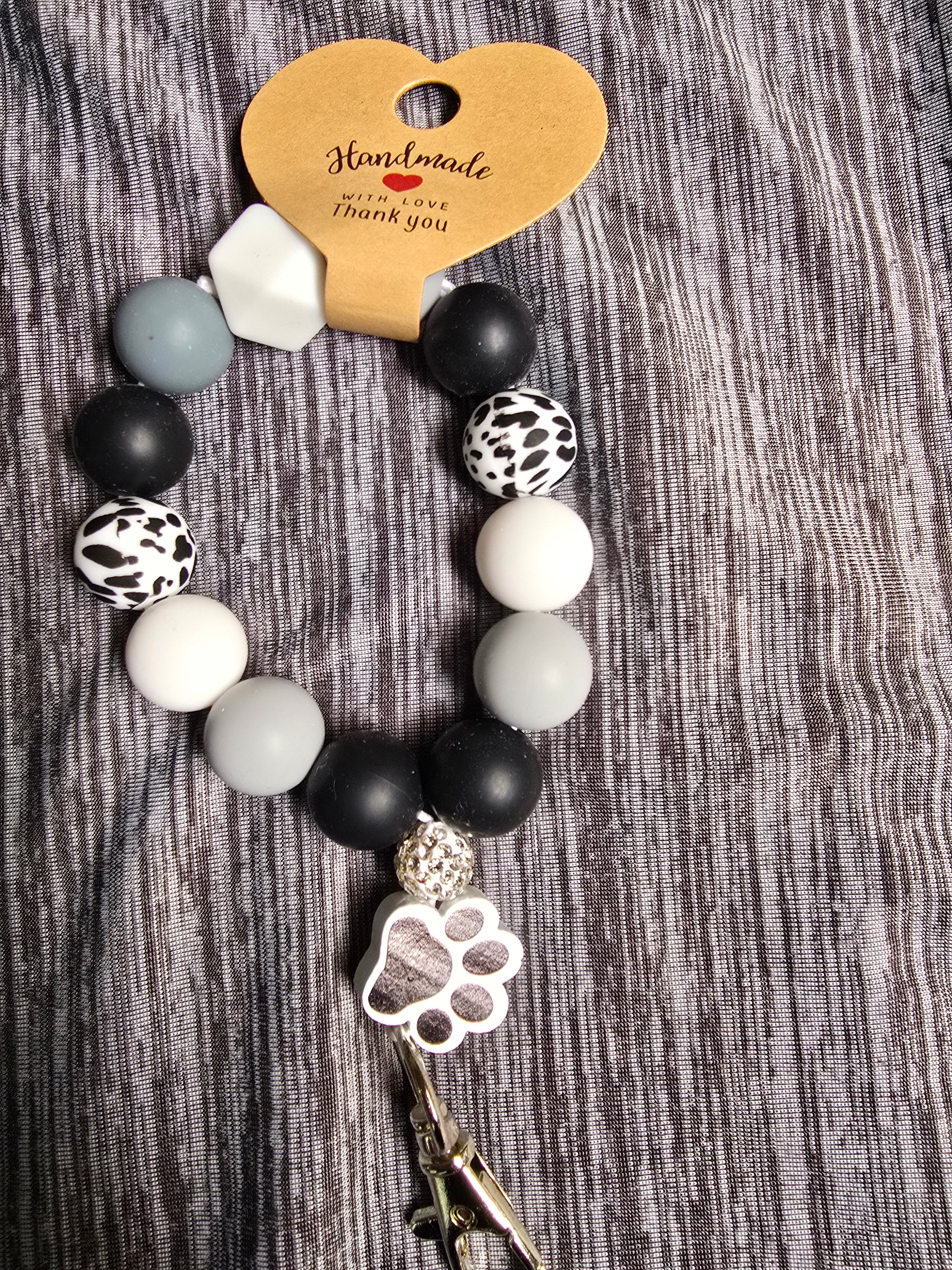 Black and white pawprint wrislet