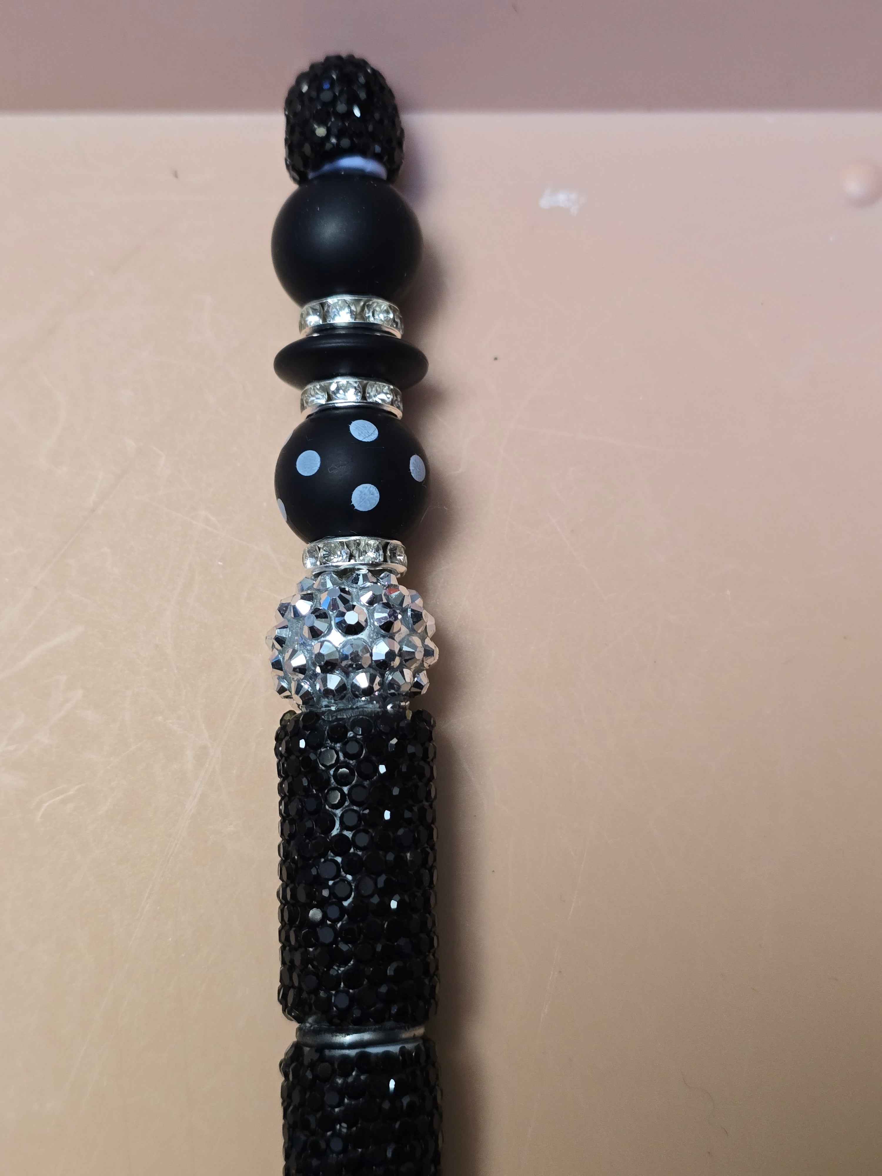 Black and silver sparkle pen