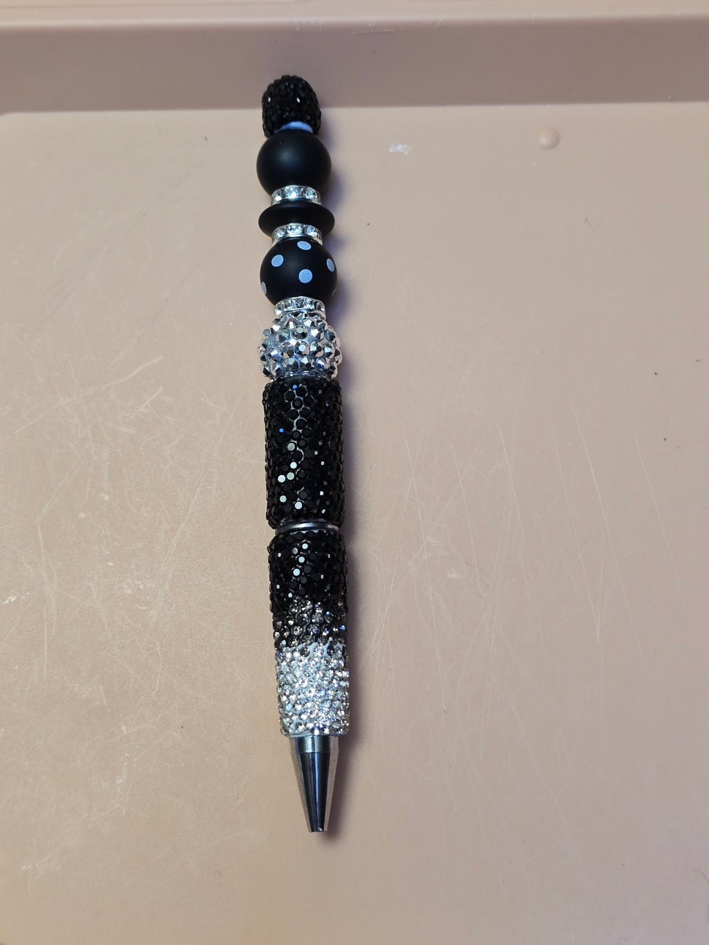 Black and silver sparkle pen