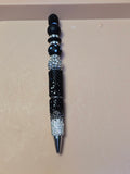 Black and silver sparkle pen