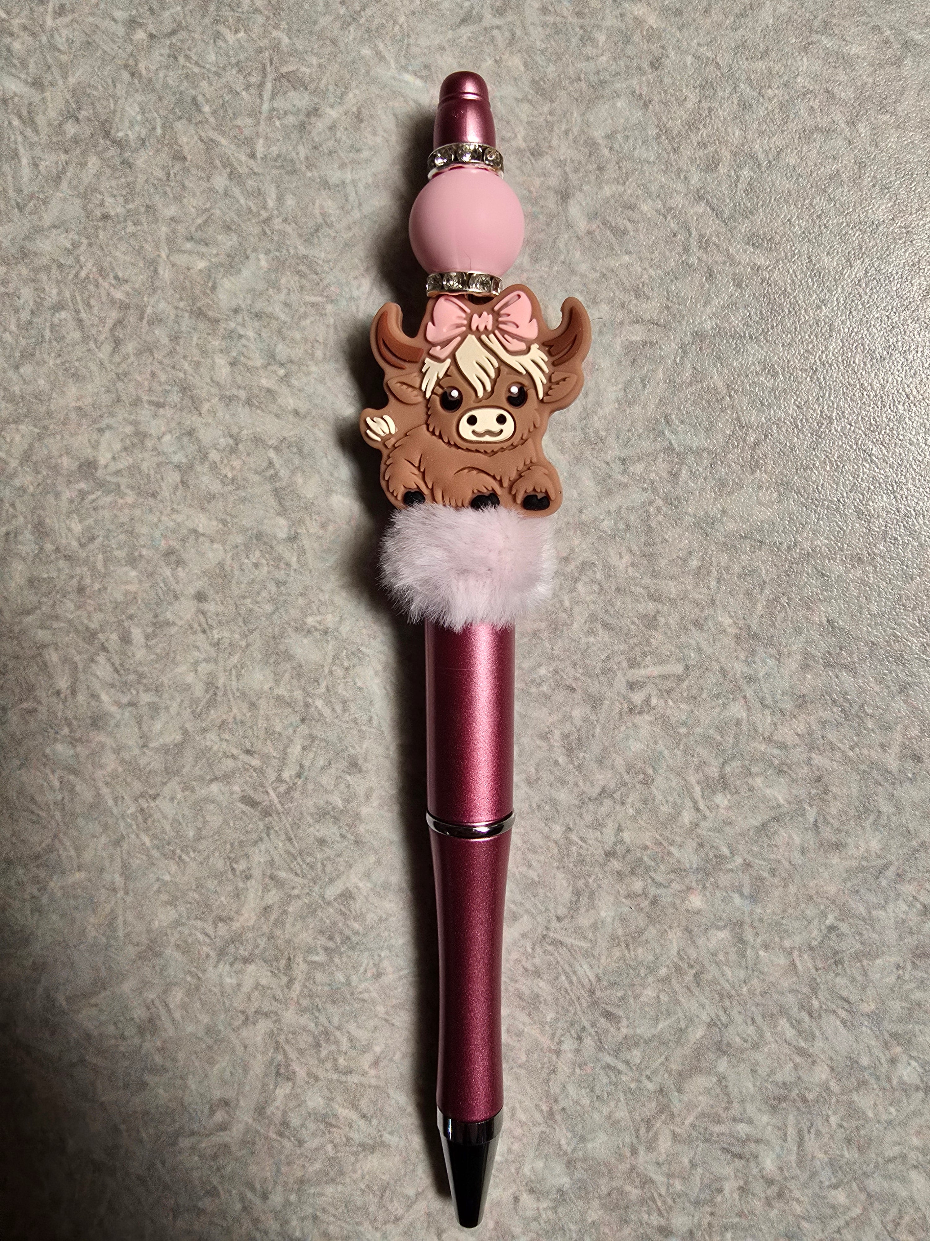 Girl highland cow pen