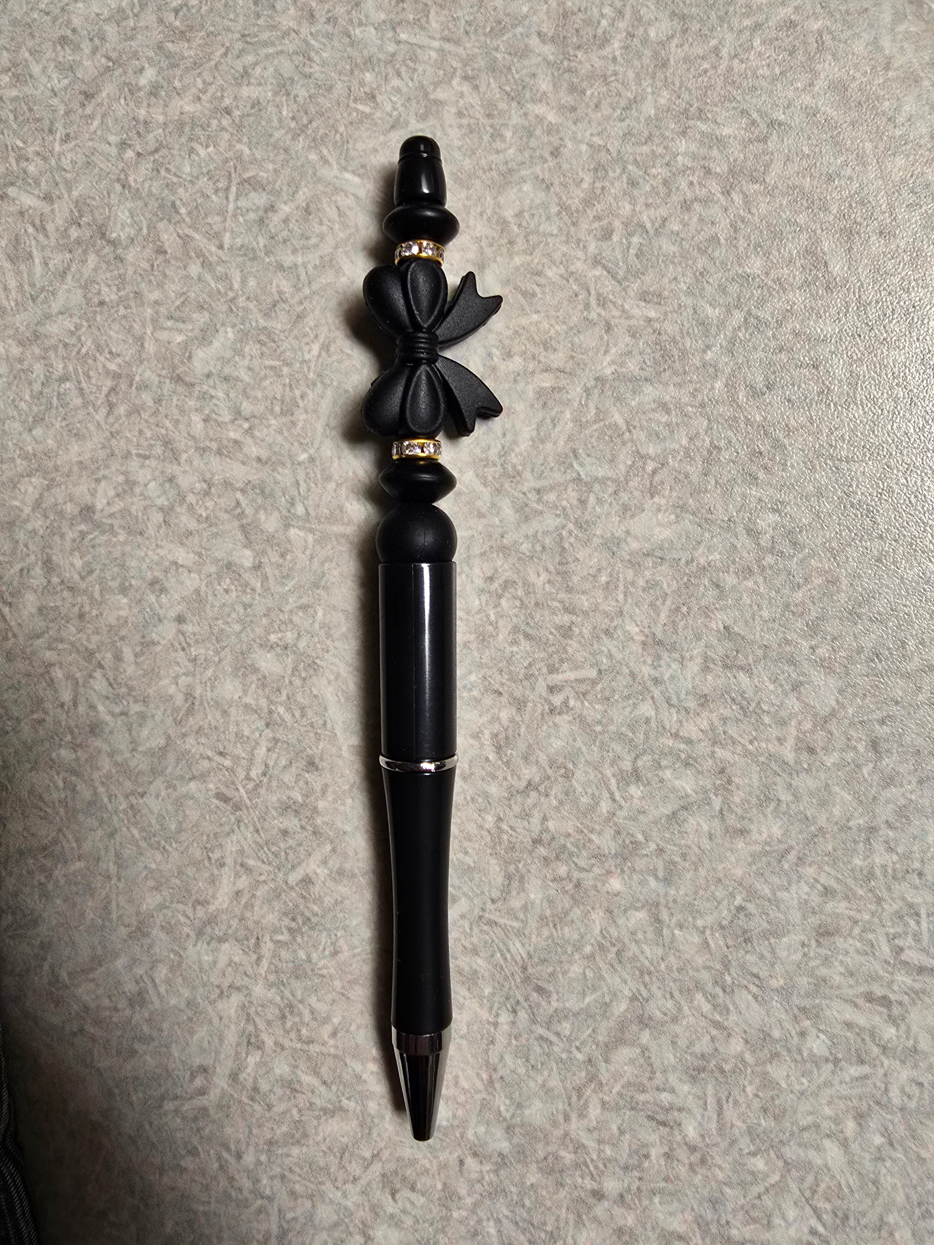 Black bow pen
