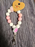 Pink and white pawprint wristlet
